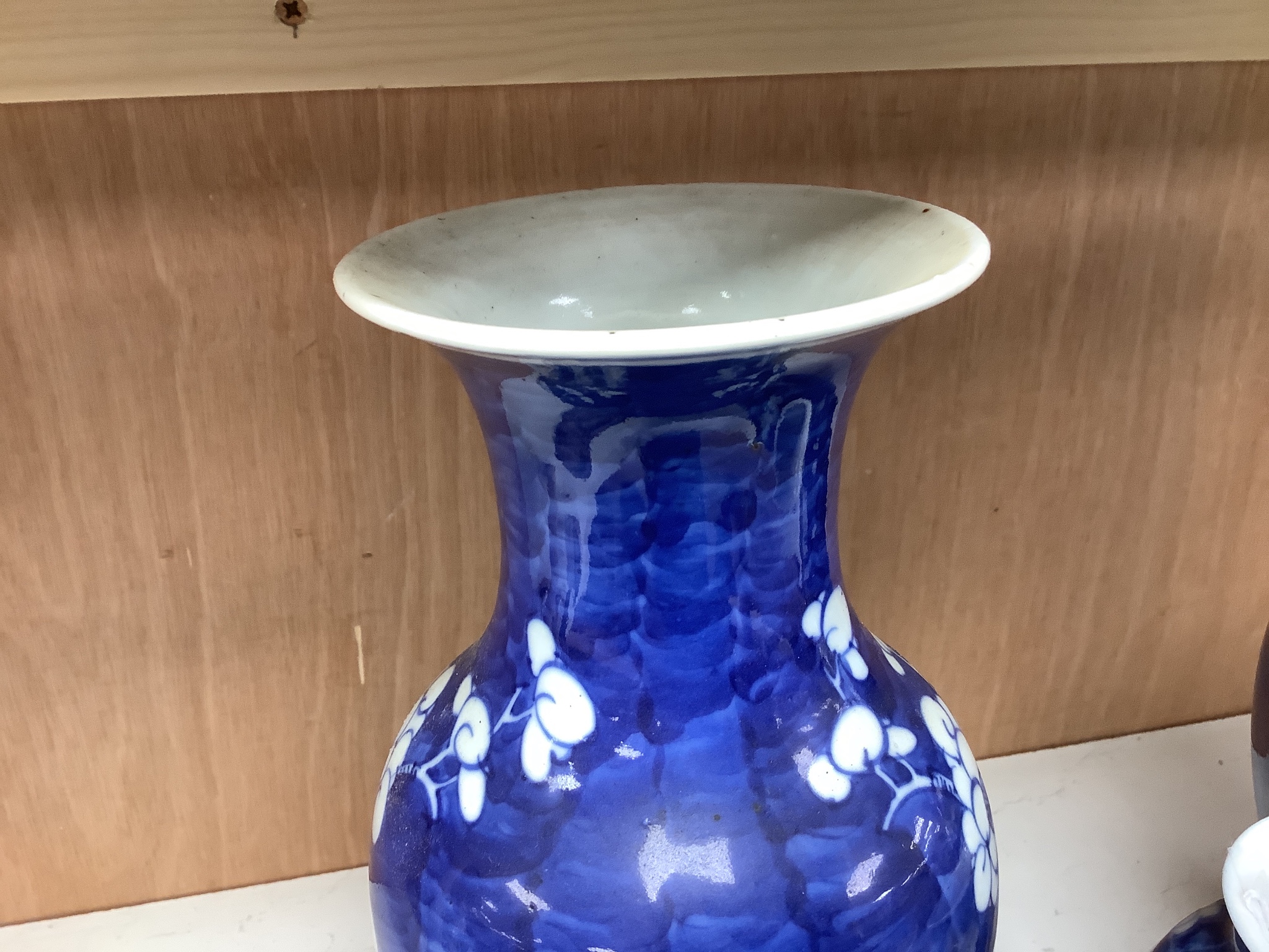 A pair of late 19th century Chinese prunus blossom baluster vases, 30cm, and a Japanese ovoid vase